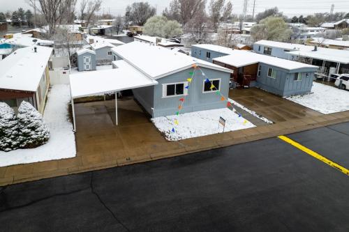 An aerial view of a mobile home park with snow on the ground.