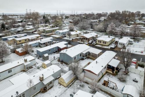 An aerial view of a snow covered neighborhood.