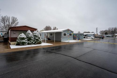 A mobile home park with a lot of snow on the ground.